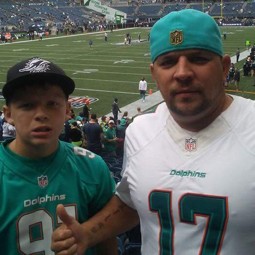 BJ and his son Benjamin Eastman III at a Miami Dolphins Football Game Dressed in Miami Dophins Football Jerseys
